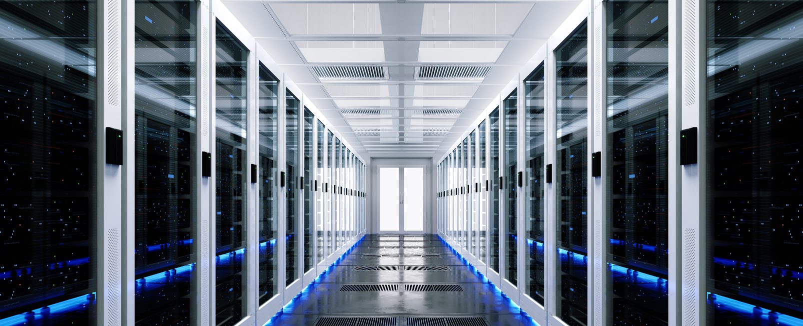 Aisle view of a modern data center with rows of server racks and blue LED lighting.